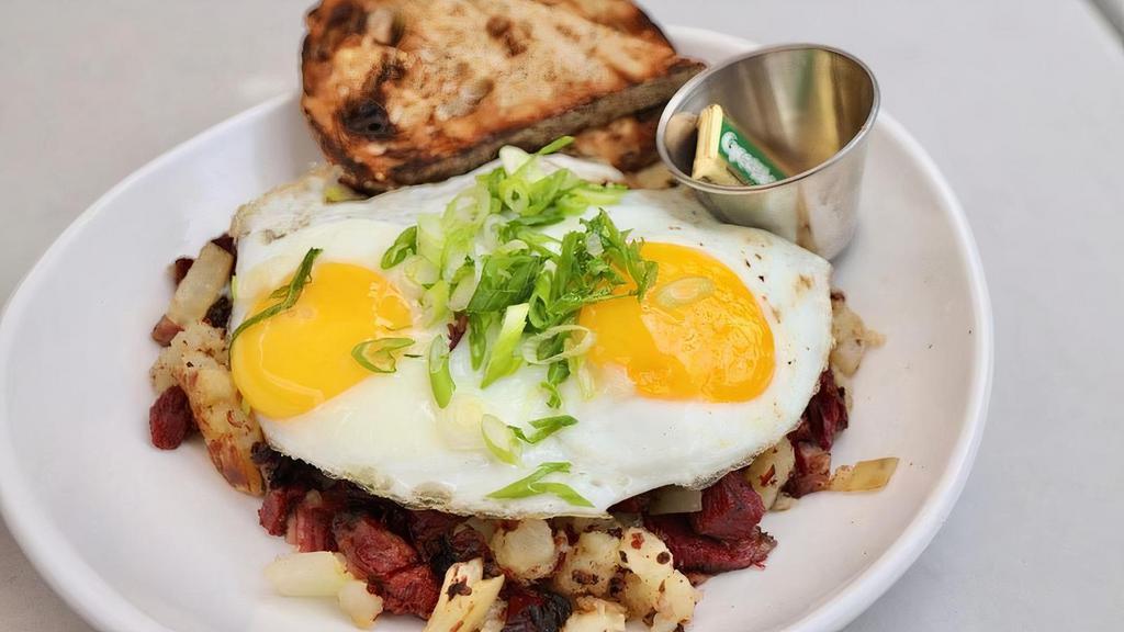 Pastrami Hash · Pastrami, potato hash, Spanish onions. Served with two sunny side eggs and whole wheat toast.