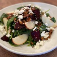 Kale Salad · Kale, roasted red beets, apple, goat cheese, candied walnuts, herb vinaigrette.