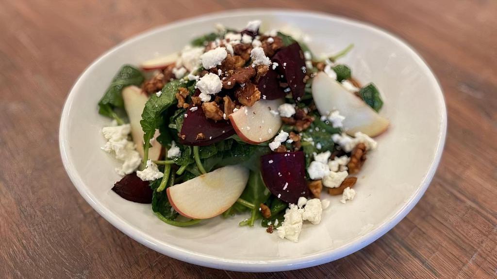Kale Salad · Kale, roasted red beets, apple, goat cheese, candied walnuts, herb vinaigrette.