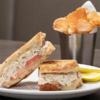 Tuna Melt · Tuna salad, aged cheddar, tomato on toasted rye with fries.