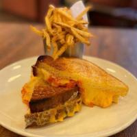 Grilled Cheese · Aged cheddar, gruyere, tomato relish on challah bread with herb fries.