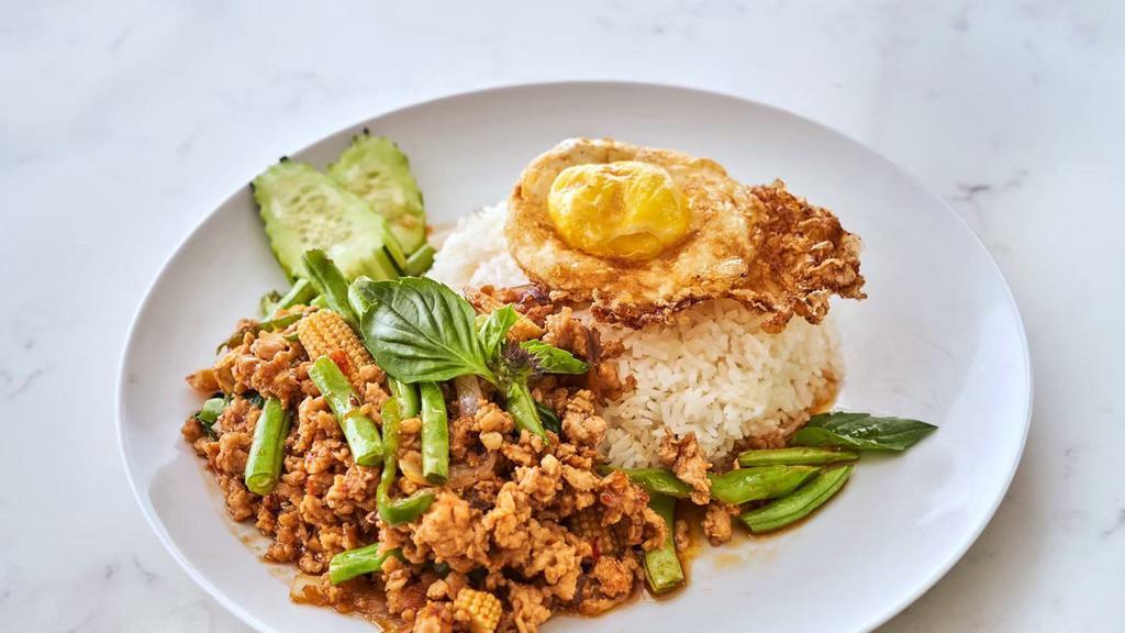 Dancing Chicken  · Mild spicy. Sautéed grounded chicken ,Red chili, Garlic, Red onion, Long hot chili, Basil, Green bean, Babycorn with Homemade Thai Basil sauce served with rice and fried egg