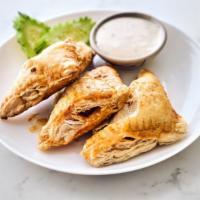 Puffy Roasted Pork · Savory pastry pockets stuffed with pork.