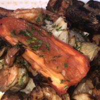 Seafood Kabob · Skewers of grilled jumbo shrimp, scallops and fish with rice and vegetables.