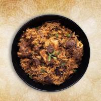 Classic Goat Biryani · Long grained rice flavored with fragrant spices flavored along with saffron and layered with...