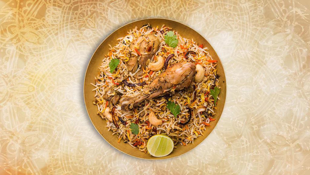 Classic Chicken Biryani · Long grained rice flavored with fragrant spices flavored along with saffron and layered with chicken and cooked with biryani masala gravy