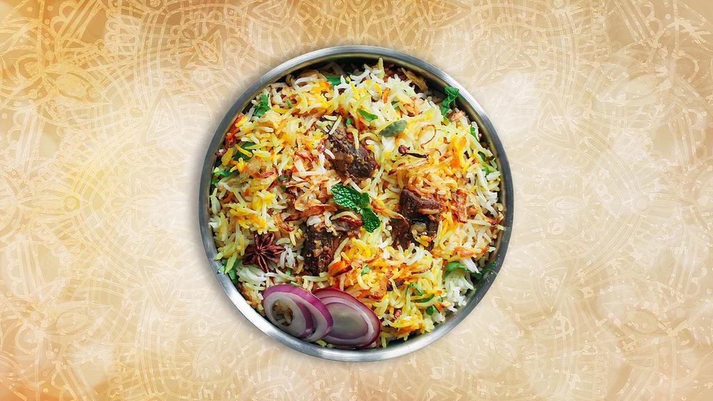 Classic Lamb Biryani · Long grained rice flavored with fragrant spices flavored along with saffron and layered with lamb and cooked with biryani masala gravy