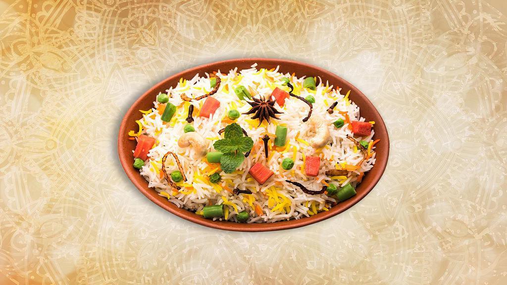Classic Veggie Biryani  · Long grained rice flavored with fragrant spices flavored along with saffron and layered with vegetables and cooked with biryani masala gravy