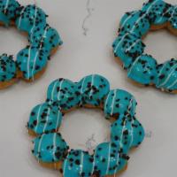 Cookie Monster Donut · Blue Vanilla Glaze with Chocolate bits and chocolate drizzle