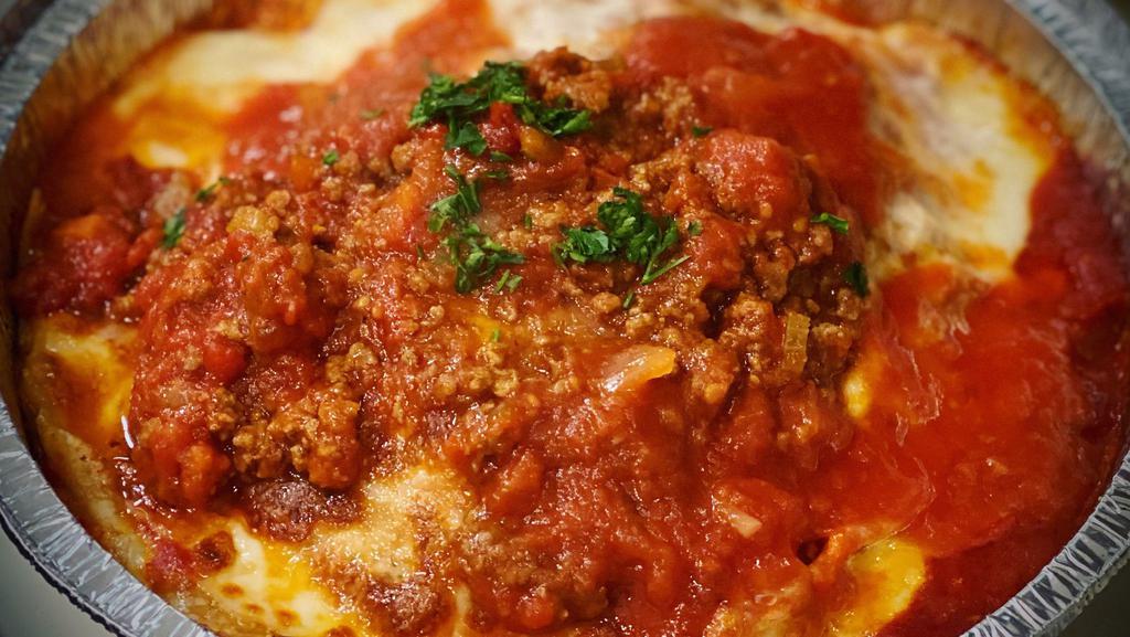 Homemade Lasagna · Our Homemade Layered Cheese Lasagna topped with Meat Sauce