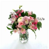 Pink Baby · A fun blend of pinks with accents of white, this cute hand tied bouquet features rose variet...