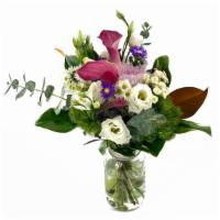 Love'S Greeting · This lush and unique bouquet features calla lilies, lisianthus with other seasonal blooms ac...