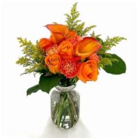 Orange You Nice · Aren't you happy this bouquet can bring a smile? This nice hand-tied bouquet features warm t...