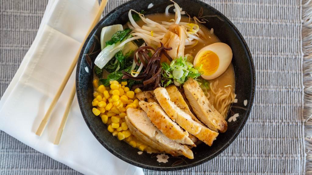 Chicken Ramen · Chicken soy egg, bamboo, bok choy, bean sprout, Earwood, mushroom, com, scallion and white thin noodle in miso flavor chicken and pork broth