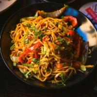 Hakka Noodles · indo chinese wheat noodles, garlic chili soy, onion, pepper, cabbage. add chicken +3