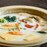 Tom Kha · Classic Tom Kha soup made with coconut milk, mushroom, galangal, kaffir lime leaf, onion, be...