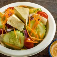 House Salad · Simply yet filling! Lettuce, onion, tomato, cucumber, carrots and steamed tofu with peanut d...
