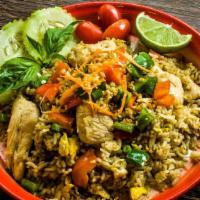 Green Curry Fried Rice · Rice, green curry paste, basil, pepper, egg, with choice of protein. Prepared in the traditi...