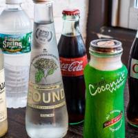 Drinks · Choose from bottled water, bottled coconut water, unfiltered ginger ale, or dry soda.