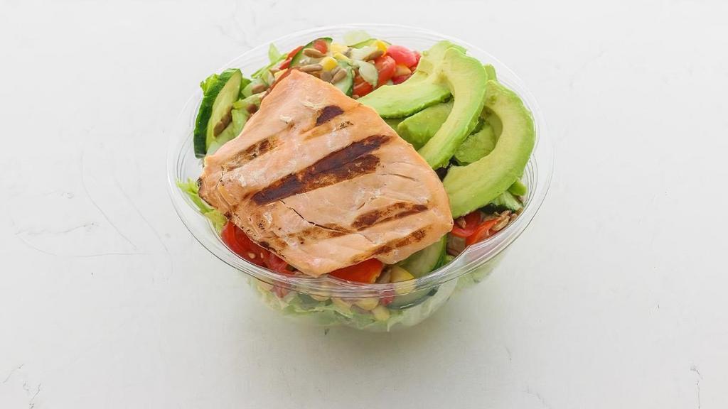 Cali Salmon · Romaine, Grilled Salmon, Tomato, Corn, Cucumber, and Chickpea Crisps with an Avocado on top!. Recommended Dressing: Green Goddess