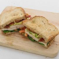 Turkey & Avocado Blt · Sliced Turkey, Avocado, Bacon, Lettuce, Tomato and Chipotle Mayo on 9-Grain bread!