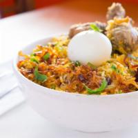 Chicken Dum Biryani · Fragrant basmati rice layered and slow-cooked with chicken leg quarters, blended with herbs ...