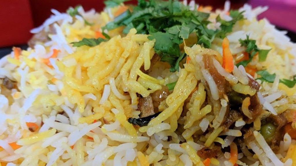 Vegetable Biryani · Vegetable biryani basmati rice cooked with mixed vegetables a blend of herbs and saffron.
