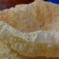 Naan · Soft leavened white bread cooked in a clay oven.