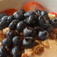 Kitchen Yogurt Parfait · Greek yogurt, blueberries, strawberries, granola, and honey.