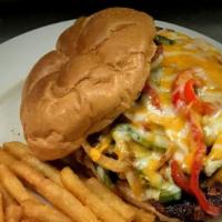 Cajun Chicken Sandwich · Cajun chicken breast topped with Monterey jack and cheddar cheese, sautéed peppers and onion...
