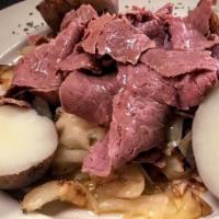 Corned Beef & Cabbage · Prepared with a hint of Irish bacon. Served with boiled red bliss potatoes.
