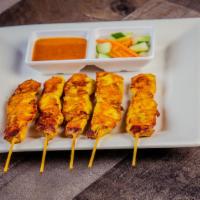 Satay · Most popular. Grilled marinated chicken skewered, cucumber salad and peanut sauce dip.