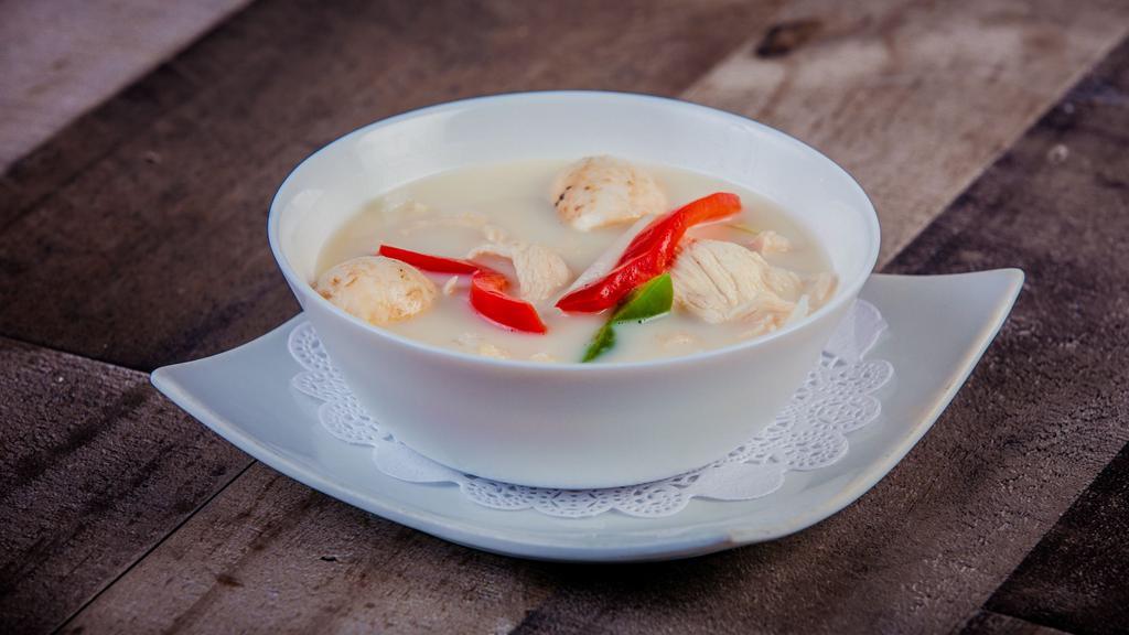 Tom Kha Soup · Coconut milk soup, galangal, mushroom, onions and bell peppers.