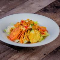 Thai Salad · Fresh mixed green, tomato cucumbers, tofu, and lime peanut dressing.