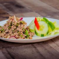 Beef Larb Salad · Spicy. Minced beef seasoned with herbs, onion and chili tossed in lime juice.