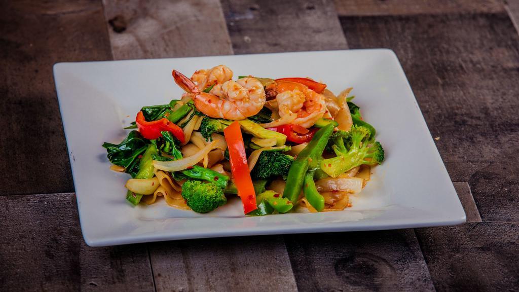 Drunken Noodles · Most popular. Spicy.  Sautéed flat rice noodles with chili paste, bell pepper, onion, broccoli, Thai broccoli, and Thai basil.