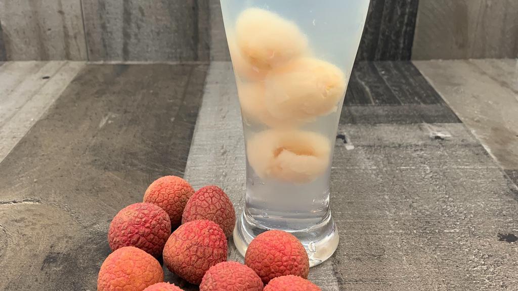 Lychee Juice With Lychee  Fruit · Delicious  Lychee juice with some lychee fruit.