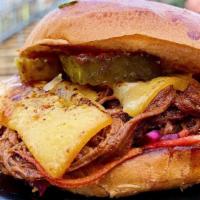 Smoked Brisket Burger + Fries · Overnight smoked brisket (lean flat) piled with Applewood smoked bacon, crispy fried onions,...