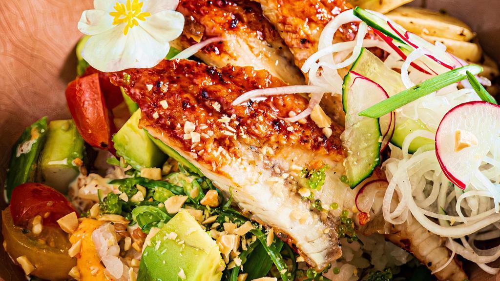 Voodoo Poke Bowl · Soy lime marinated fresh salmon or tuna mixed in a sweet and creamy voodoo sauce with avocado, mango, cucumber, edamame, seaweed salad, sesame, tempura flakes, and fried onions