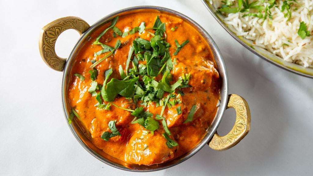 Chicken Tikka Masala · Boneless pieces of chicken tikka cooked in a creamy butter sauce with fresh tomatoes and fragrant spices.