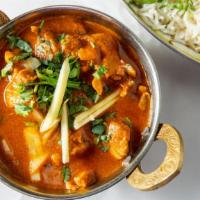 Chicken Curry · Chicken cooked in three light gravy and mild or hot.