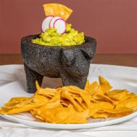 Fresh Guacamole · Served with chips.