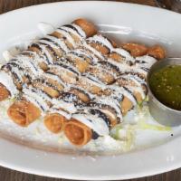 Cheese Tacos Dorados · Served with sour cream, black beans, fresh cheese and side of homemade salsa Verde.