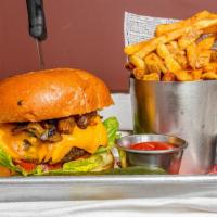 Cheese Burger · Served with sautéed mushroom and onions with truffle oil, lettuce, tomato, and fries.
