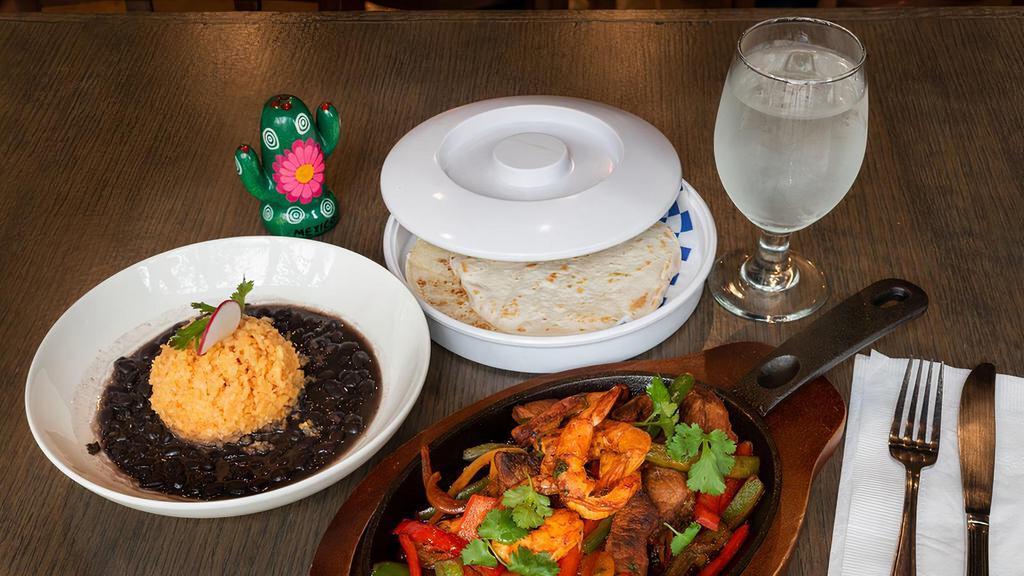 Mixed Fajita · Served with rice beans, sautéed peppers, onions and flour tortillas.