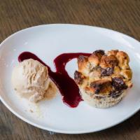 Bread Pudding · Served with salted caramel gelato and berry sauce.
