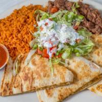 Kids Quesadilla · Flour tortilla stuffed with Monterrey jack and chedder cheese with either chicken, steak or ...