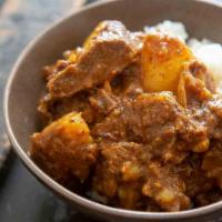 Curry Goat Meal · Curry seasoned dish.