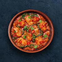 Andhra Chicken Curry · Tender chicken cooked in a sauce made with traditional Indian herbs and coconut milk.