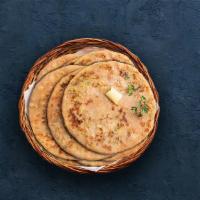 Aloo Paratha · Whole wheat flatbread loaded with herbed potato mixture.